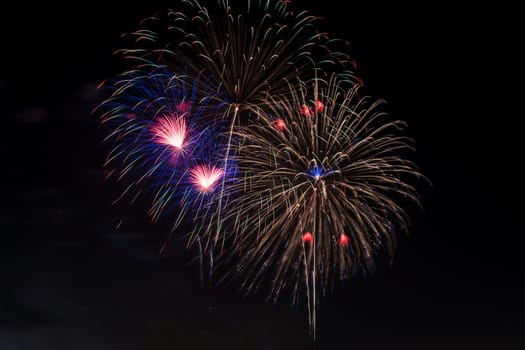 Colorful fireworks display at holiday night.