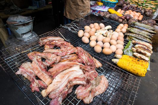 grilled pork at street market in Thailand