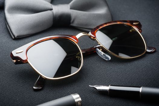 accessories for men, close up at brown sunglasses.