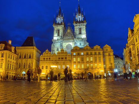 Prague, Czech Republic - September 23, 2018: Church of our Lady before Tyn, Old Town Square, Prague, Czech Republic. Tourists enjoying the city at night.