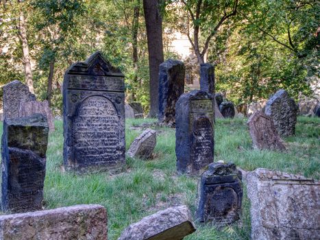 Prague, Czech Republic - September 26, 2018: Tombstones on Old Jewish Cemetery in the Jewish Quarter in Prague.There are about 12000 tombstones presently visible. One of the most important Jewish monument.