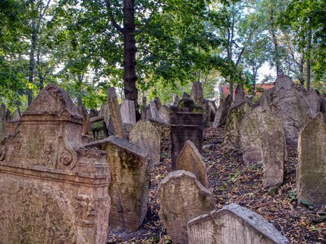 Prague, Czech Republic - September 26, 2018: Tombstones on Old Jewish Cemetery in the Jewish Quarter in Prague.There are about 12000 tombstones presently visible. One of the most important Jewish monument.