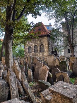 Prague, Czech Republic - September 26, 2018: Tombstones on Old Jewish Cemetery in the Jewish Quarter in Prague.There are about 12000 tombstones presently visible. One of the most important Jewish monument.