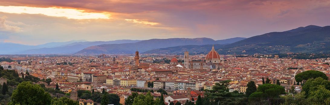 Panorama of Duomo Santa Maria Del Fiore and tower of Palazzo Vecchio at sunset in Florence, Tuscany, Italy