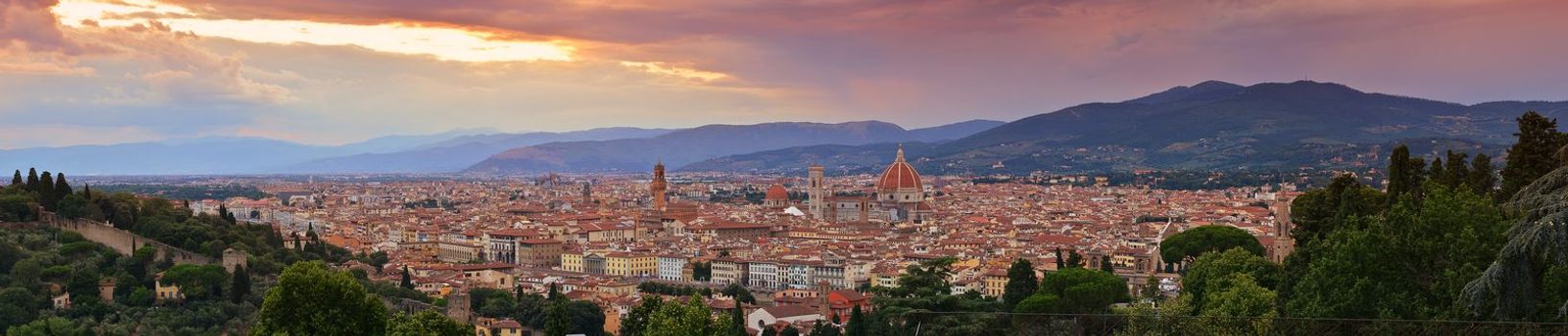 Panorama of Duomo Santa Maria Del Fiore and tower of Palazzo Vecchio at sunset in Florence, Tuscany, Italy