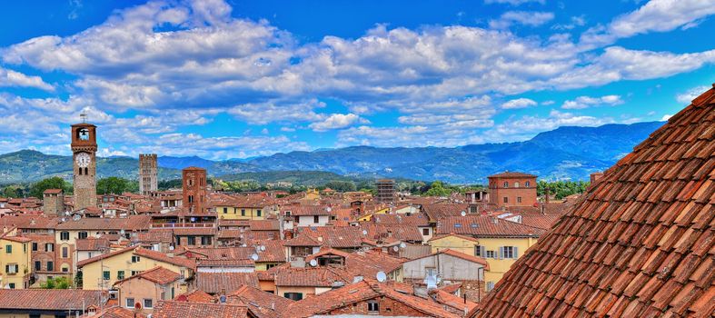 Lucca, Italy - June 26,2018: Beautiful medieval town Lucca in Tuscany. Houses with red roofs.