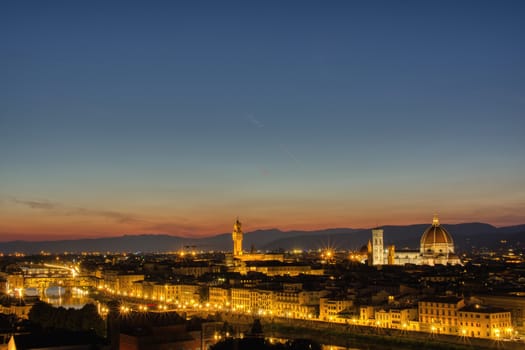 Duomo Santa Maria Del Fiore and tower of Palazzo Vecchio at sunset in Florence, Tuscany, Italy