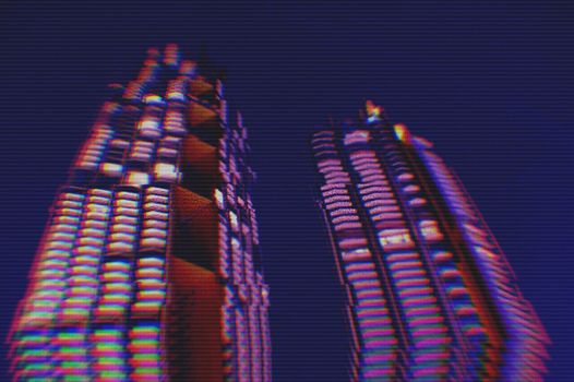 View of modern buildings in the city night background with digital glitch effect