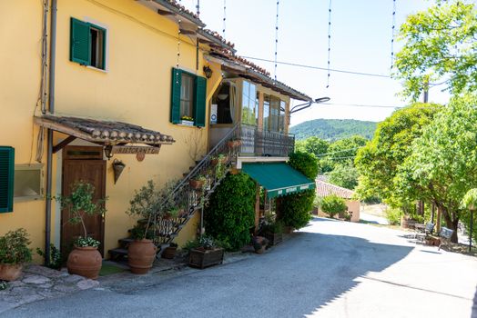 macerino,italy june 02 2020 :restaurant macerino fountains with bar and food at the bottom