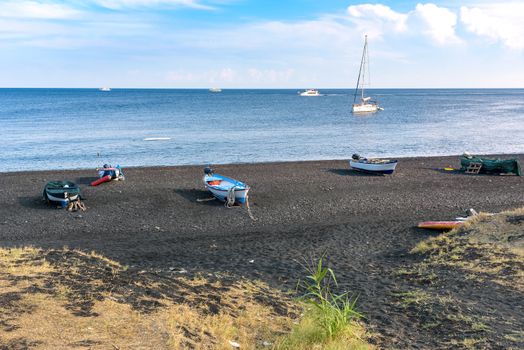 Boats on the black volcanic beach on Stromboli Island