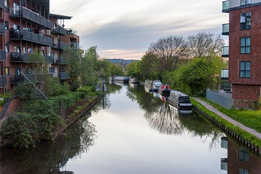 Narrowboats moored at the Grand Union Canal in West Drayton, London, UK