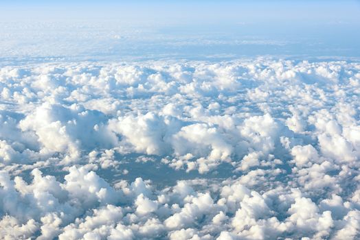 Natural background made of clouds seen from the plane window