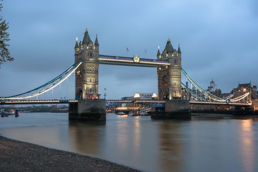 View of thr Tower Bridge in London at dusk on a cloudy day