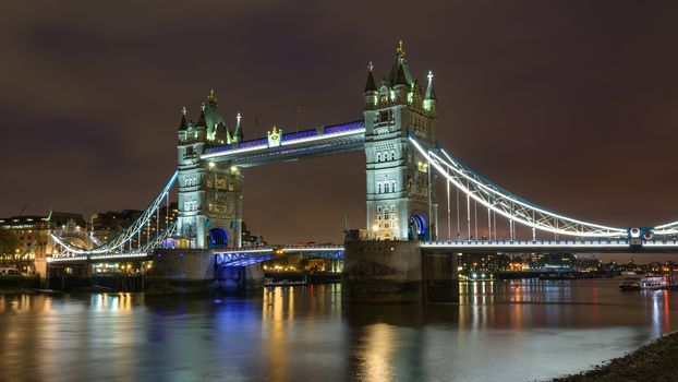 View of thr Tower Bridge in London at night on a cloudy day