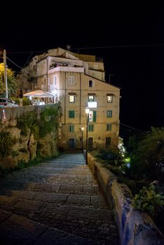 Buildings on a cliff in Tropea by night, Calabria, Italy