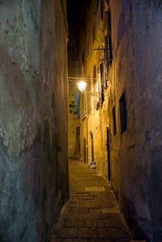 Narrow street in Tropea town at night, Calabria, Italy