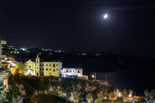 Buildings of Tropea town in the moon light, Calabria, Italy