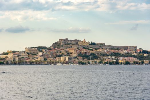 View of Milazzo town from the sea at sunset, Sicily, Italy