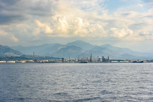 Industrial zone in Milazzo town on Sicily seen from the sea, Italy