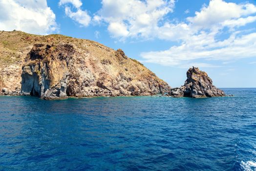 Rocky cliff coast of the Lipari Island seen from the sea, Aeolian Islands, Italy