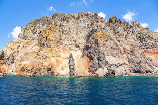 Rocky cliff coast of the Lipari Island seen from the sea, Aeolian Islands, Italy