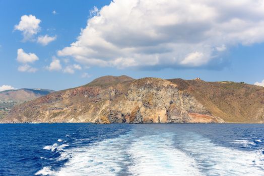 Rocky cliff coast of the Lipari Island seen from the sea, Aeolian Islands, Italy