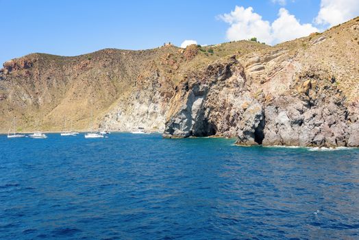 Yachts at the rocky coast of Lipari Island, Aeolian Islands, Italy