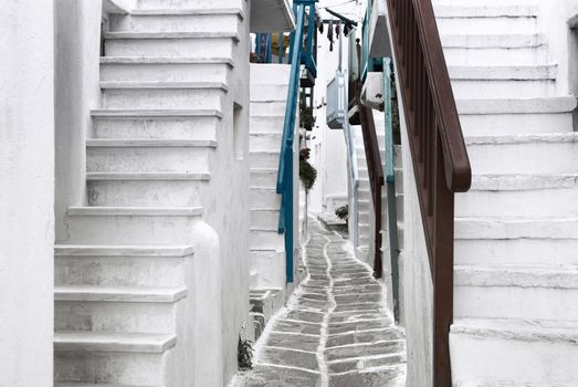 Beautiful whitewashed street in the old town of Mykonos, Greece