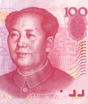 Partial view of a one hundred Chinese Yuan banknote showing a portrait of chairman Mao-Tse Tung

