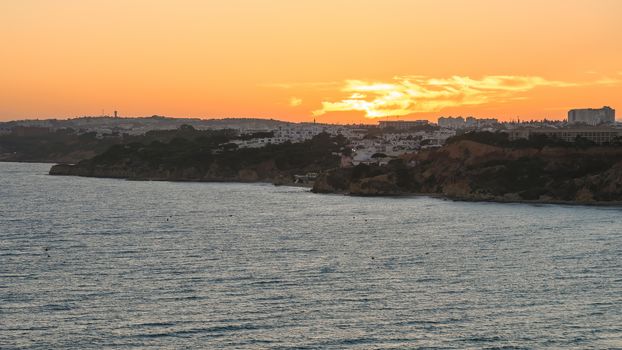 Atlantic coastline in Algarve region in Portugal at dusk