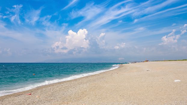 Panoramic view of a gravel beach at the Tyrrhenian Sea in Calabria, Italy