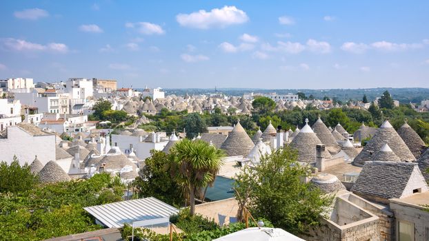 Panoramic view of famous Alberobello town with trulli houses and their conical roofs