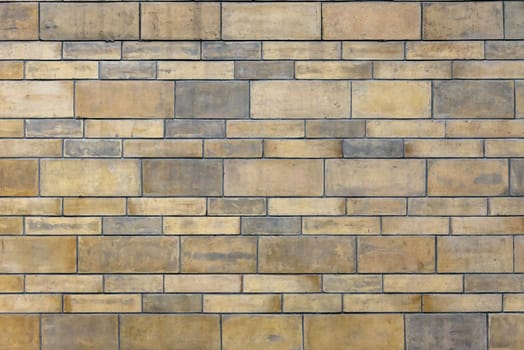 Background made of yellow brick wall texture