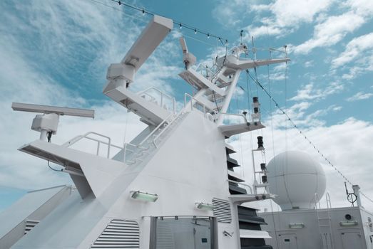 Satellite communication antenna on the top of large passenger ship. Close details of radar navigation system and communication tower