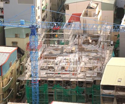 Apartment construction site in a densely populated neighborhood
