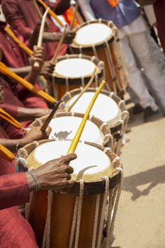 Close up of Group of People hands performing Indian art form Chenda or chande a cylindrical percussion playing during festival