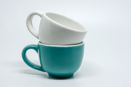 Two cup of coffee overlap on white background for utensil and dishware concept