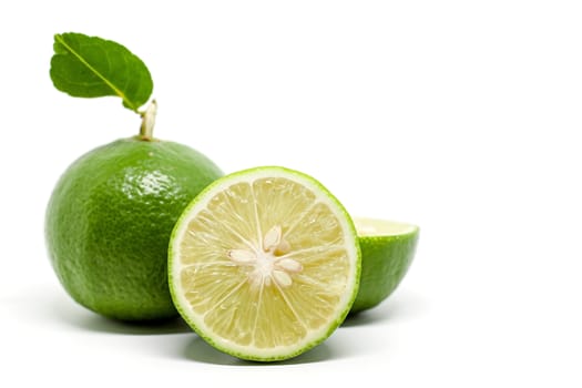 Green lime on white background for food ingredients and cooking concept