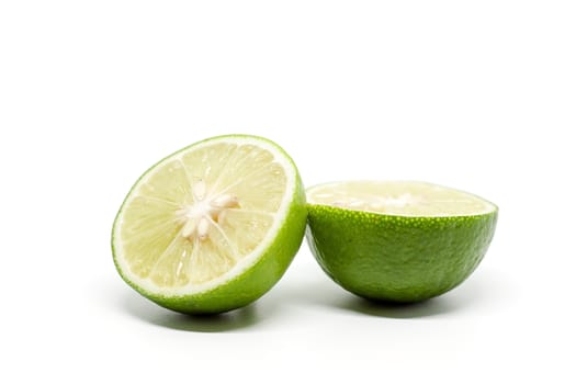 Green lime on white background for food ingredients and cooking concept