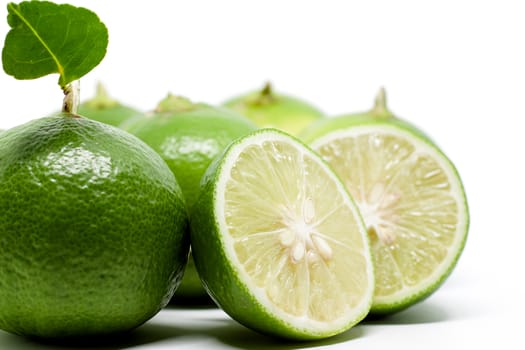 Green lime on white background for food ingredients and cooking concept