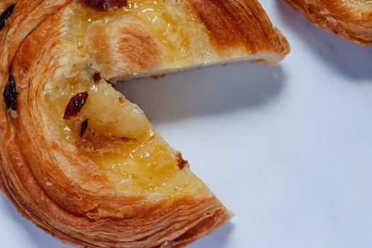 Top view of delicious bread on white marble background for food, bakery and eating concept