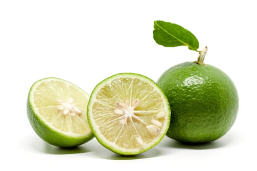 Green lime on white background for food ingredients and cooking concept