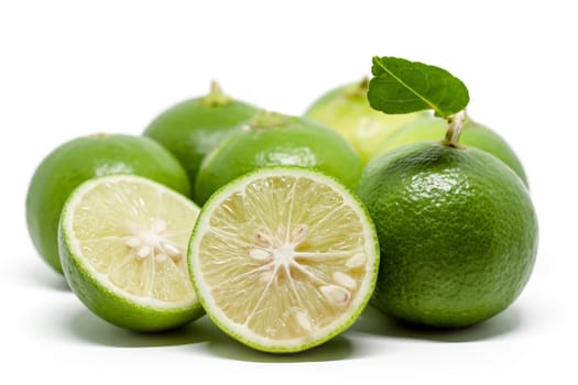 Green lime on white background for food ingredients and cooking concept