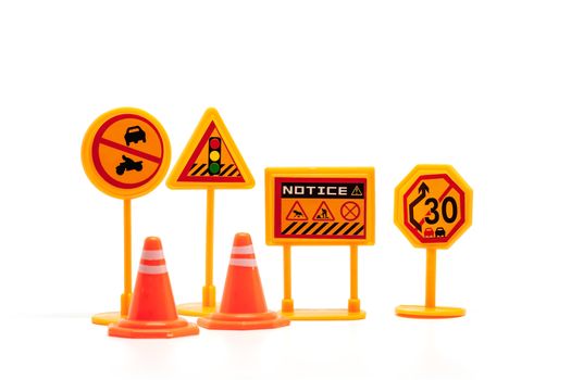 Set of mini traffic sign toy on white background for transportation concept 