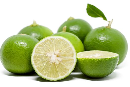 Green lime on white background for food ingredients and cooking concept