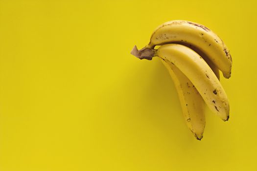 Bunch of bananas on yellow background for  eating healthy concept