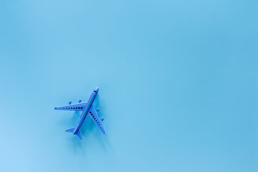 Airplane model on blue background for vehicle and transportation concept