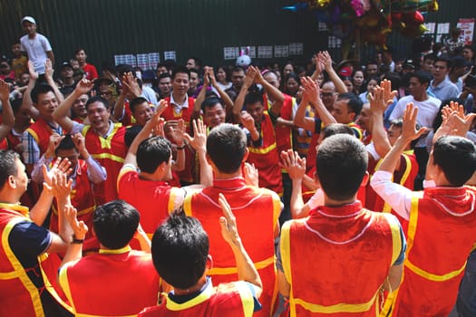 People celebrating the traditional Dong Ky Firecracker Festival or Hoi Phao Dong Ky in Bac Ninh, Vietnam