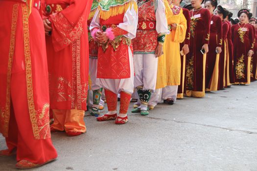 Editorial. Women called Hoi dong tue wearing festival clothes during a parade for Hoi Phao Dong Ky or Dong Ky Firecracker Festival in Bac Ninh, Vietnam