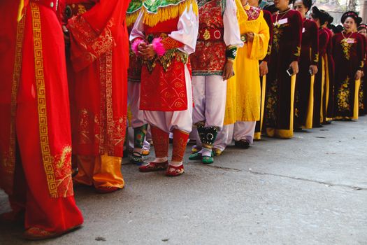 Women called Hoi dong tue wearing festival clothes during a parade for Hoi Phao Dong Ky or Dong Ky Firecracker Festival in Bac Ninh, Vietnam